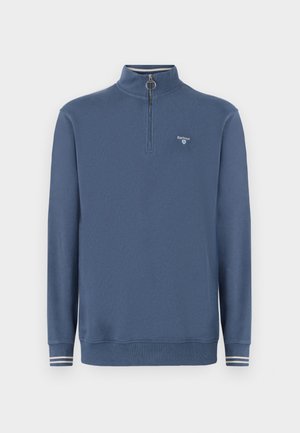 Blue fleece pullover with a zippered mock neck, long sleeves, and ribbed cuffs featuring white stripes. Logo on the left chest area.