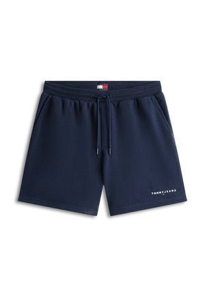 Σκούρα μπλε navy καλοκαιρινές βερμούδες με ελαστική μέση και κορδόνι, πλαϊνές τσέπες, λογότυπο Tommy Jeans στο αριστερό πόδι και μικρή σημαία Tommy Hilfiger στο κέντρο της μέσης.
