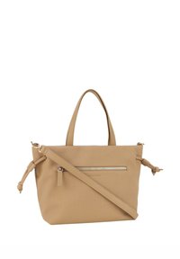 Borsa a tracolla in tela beige con due manici, cinturino per spalla rimovibile, tasca frontale con cerniera e dettagli annodati sui lati.