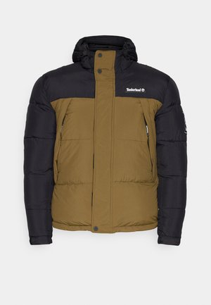 Giacca a vento con cappuccio, caratterizzata da un davanti beige e maniche nere. Ha tasche con zip e chiusure a pressione sul davanti. Logo Timberland visibile.