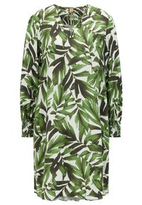 Vestido largo con una tela blanca decorada con patrones de hojas en verde y verde oscuro. Mangas fruncidas con puños elásticos. Escote redondo con un detalle de lazo.