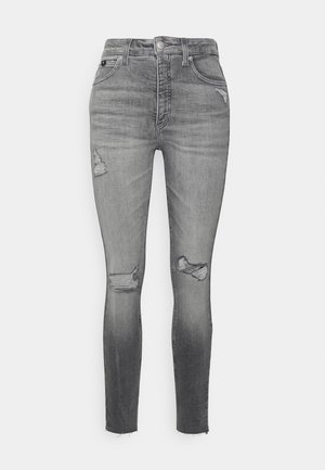 Graue High-Waist Skinny-Jeans mit abgenutzten Stellen an Oberschenkeln und Knien, ausgefransten Säumen, Frontreißverschluss und Fünf-Taschen-Design.