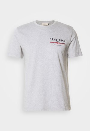 Gray cotton t-shirt with short sleeves, round neckline, and printed text in navy and red. Features a logo and horizontal stripes.