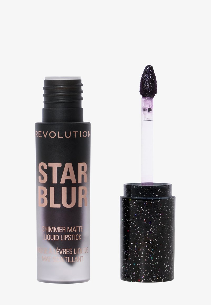 Flytende leppestift i en sylinderformet svart beholder med gulltekst. Inkluderer en applikator med lilla svamp og et glitrende svart lokk.