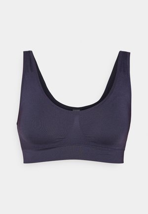 Brassière sans couture violet foncé avec de larges bretelles, un décolleté en scoop et une texture lisse. Aucun matériel ni décoration visible.