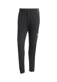 Sort joggingbukser lavet af struktureret stof med elastisk talje, to sidelommer og hvid branding på venstre lår.