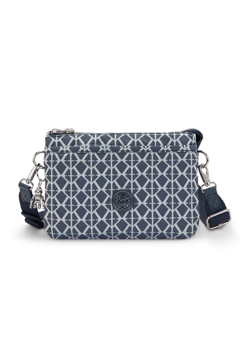 Kleine, marineblaue Umhängetasche mit geometrischem weißen Diamantmuster, vorderer Reißverschluss-Tasche, verstellbarem Schulterriemen und angehängt einem metallischen Schlüsselanhänger.