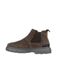 Stivaletto in suede marrone con pannelli elasticizzati sui lati, suola in gomma e cucitura beige. Presenta una linguetta sul retro per una facile calzata.