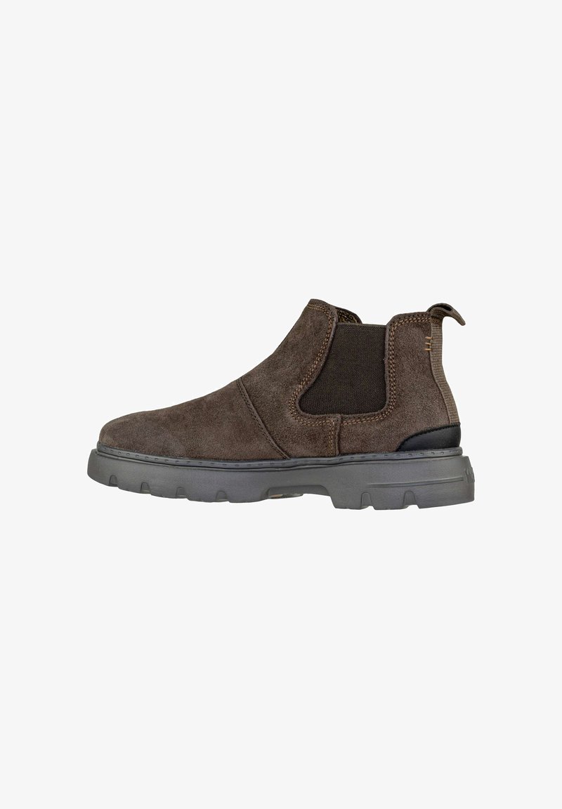 Stivaletto in suede marrone con pannelli elasticizzati sui lati, suola in gomma e cucitura beige. Presenta una linguetta sul retro per una facile calzata.