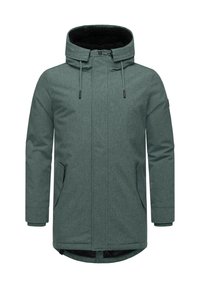 Zöld textúrájú parkajacket kapucnival, fekete bélésű belső résszel, elülső cipzárral és két oldalsó zsebbel. Hosszú ujjú, mandzsettával.