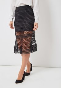 CALADA - Falda acampanada - black