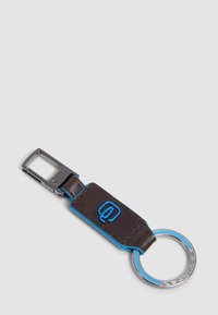 Keyring with a dark brown leather strap, blue edging, metal clip, and silver ring featuring blue accents and engraved branding.