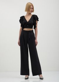 Calliope PALAZZO - Pantalon classique - nero