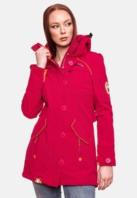 Fuchsia hooded jacket with orange accents, button closure, two front pockets, and patch detail on the sleeve. Soft, textured fabric.