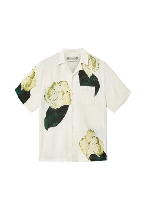 Hvid kortærmet skjorte med knapper, store grønne og gule blomsterprint og en brystlomme.