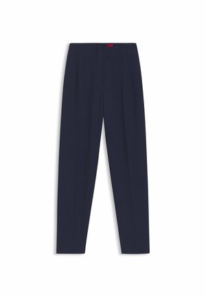Pantaloni su misura blu navy con una texture liscia, dotati di pieghe frontali e tasche laterali. Design a gamba dritta e senza decorazioni visibili.