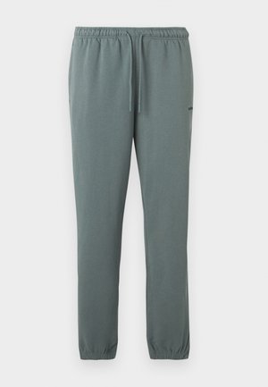 Ανοιχτό γκρι-πράσινο παντελόνι φόρμας με ελαστική μέση, κορδόνι, πλαϊνές τσέπες, ελαστικές μανσέτες και μικρό μαύρο λογότυπο στο αριστερό μηρό.