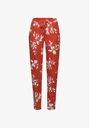 Červené kalhoty s bílým vzorem listů, se strečovým pasem a šňůrkou, zúženými nohavicemi a měkkou, hladkou texturou.