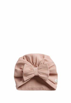 Soft ribbed pink baby hat with large bow on front and small fabric tag on side.