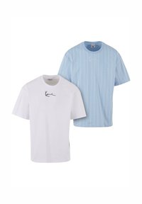 Two t-shirts: one white with a black logo, and one light blue with white vertical stripes and a small logo on the chest.