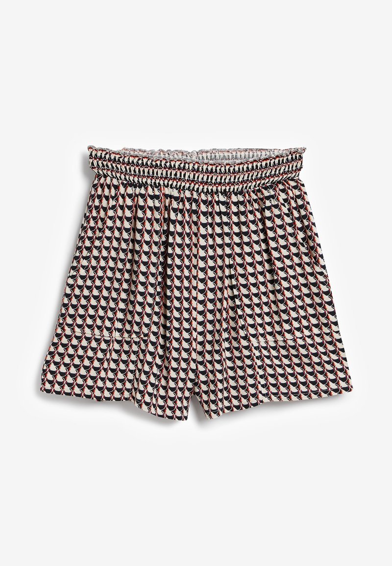 Short taille haute avec une ceinture smockée, présentant un motif géométrique de formes festonnées noires, blanches et rouges.