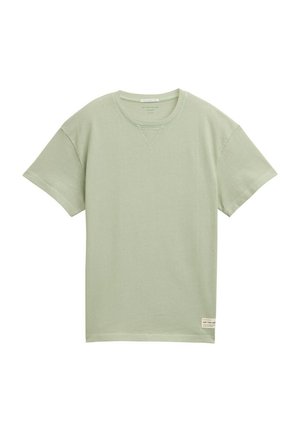 Ljusgrön bomulls-T-shirt med rund halsringning, korta ärmar och en subtil textur; har en liten etikett vid nederkanten.