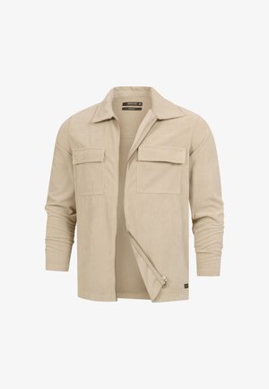 Giacca in corduroy beige con maniche lunghe, colletto a punta, zip frontale e due tasche a patta sul petto, mostrata parzialmente aperta.