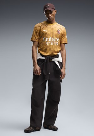 Puma, Fodboldtrøjer - archive gold- black