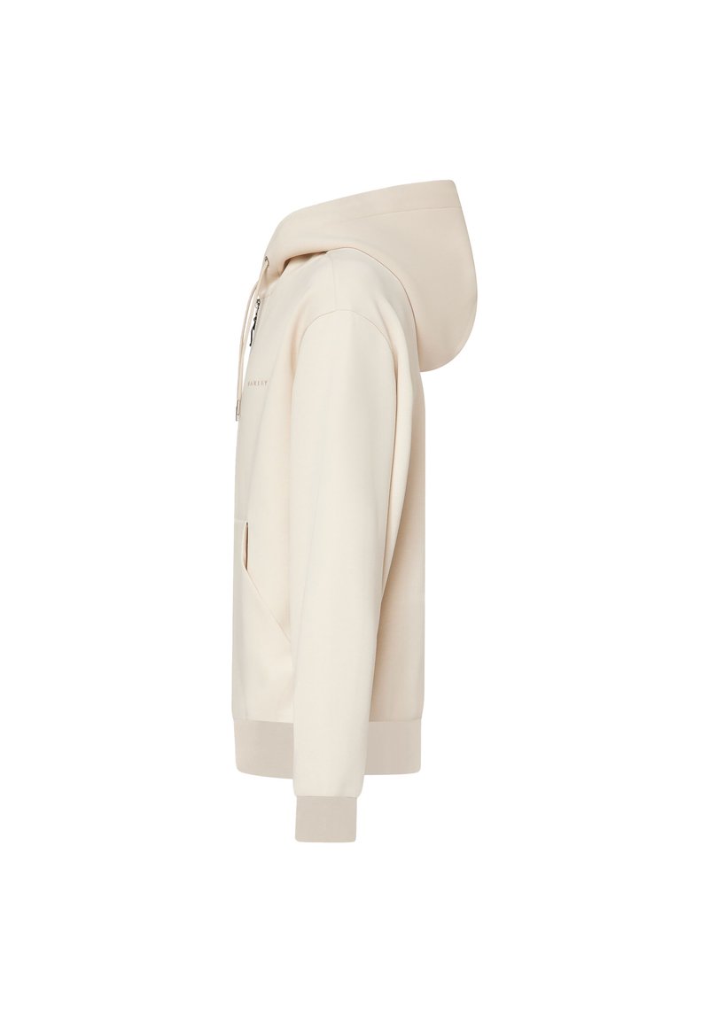 Sweat à capuche beige zippé avec poches avant, capuche avec cordon, manches longues et poignets et ourlet côtelés, vu de profil.