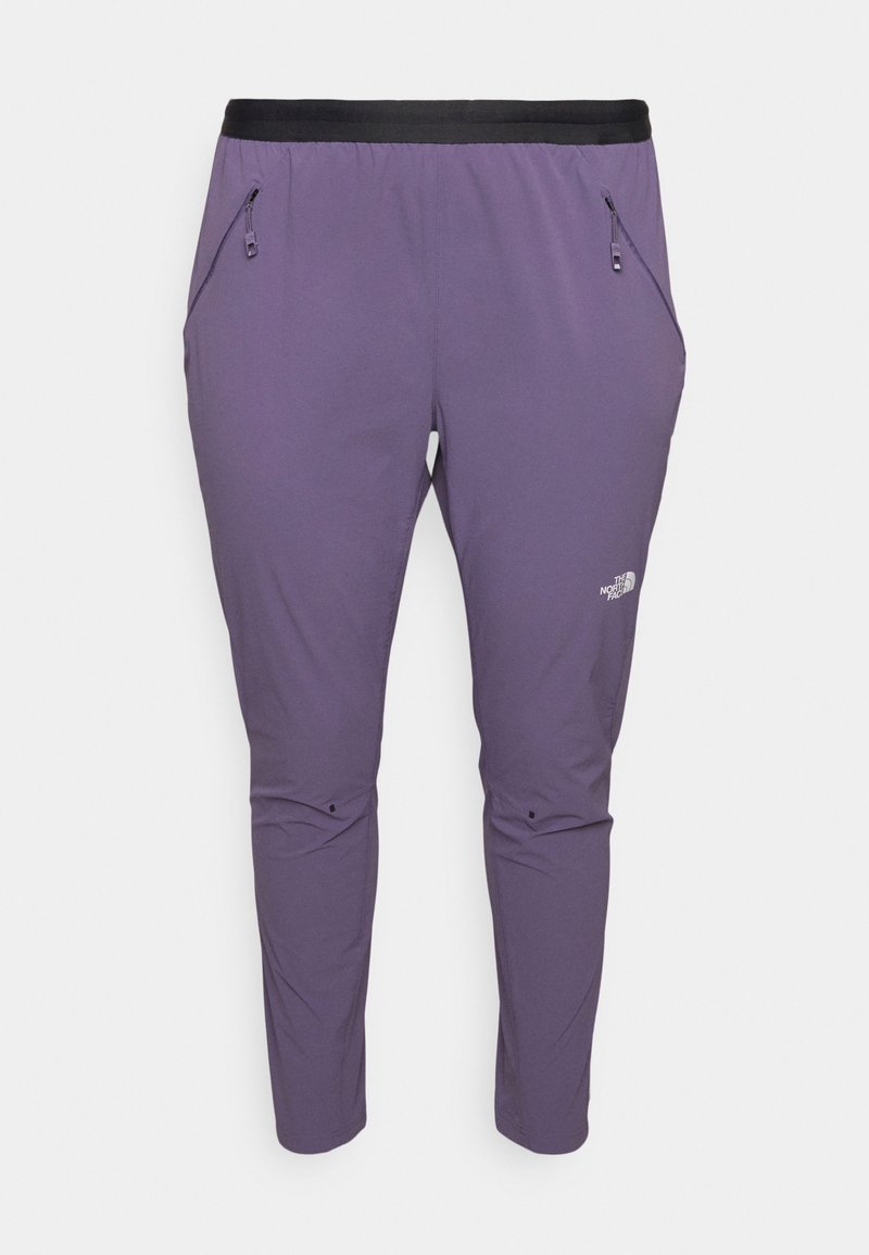 Pantalon d'extérieur ajusté violet avec ceinture élastique noire, poches latérales zippées et logo The North Face sur la cuisse droite.