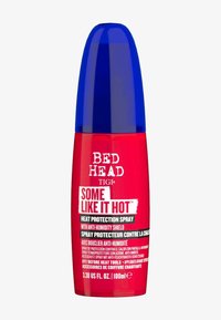 Bed Head TIGI Hitzeschutzspray in einer roten Flasche mit blauem Deckel. Mit fettem weißem Text und einem Etikett, zylindrische Form, 100ml Größe.