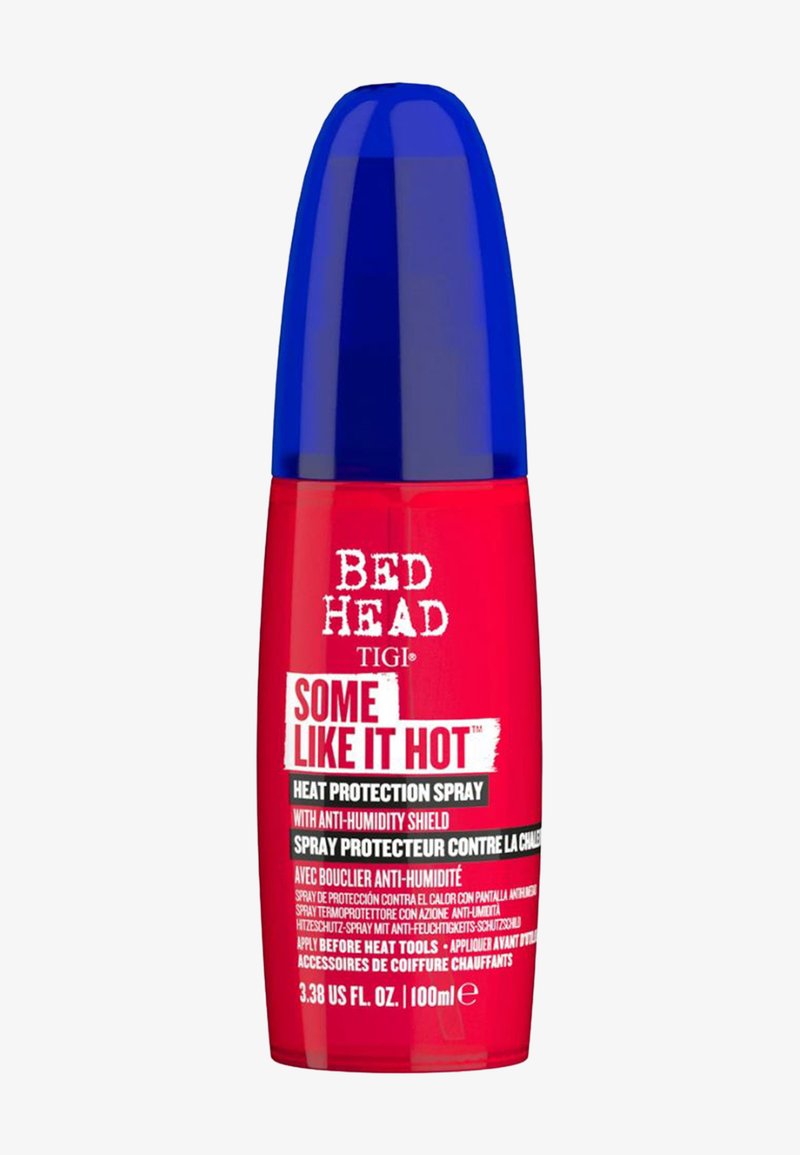 Bed Head TIGI Hitzeschutzspray in einer roten Flasche mit blauem Deckel. Mit fettem weißem Text und einem Etikett, zylindrische Form, 100ml Größe.