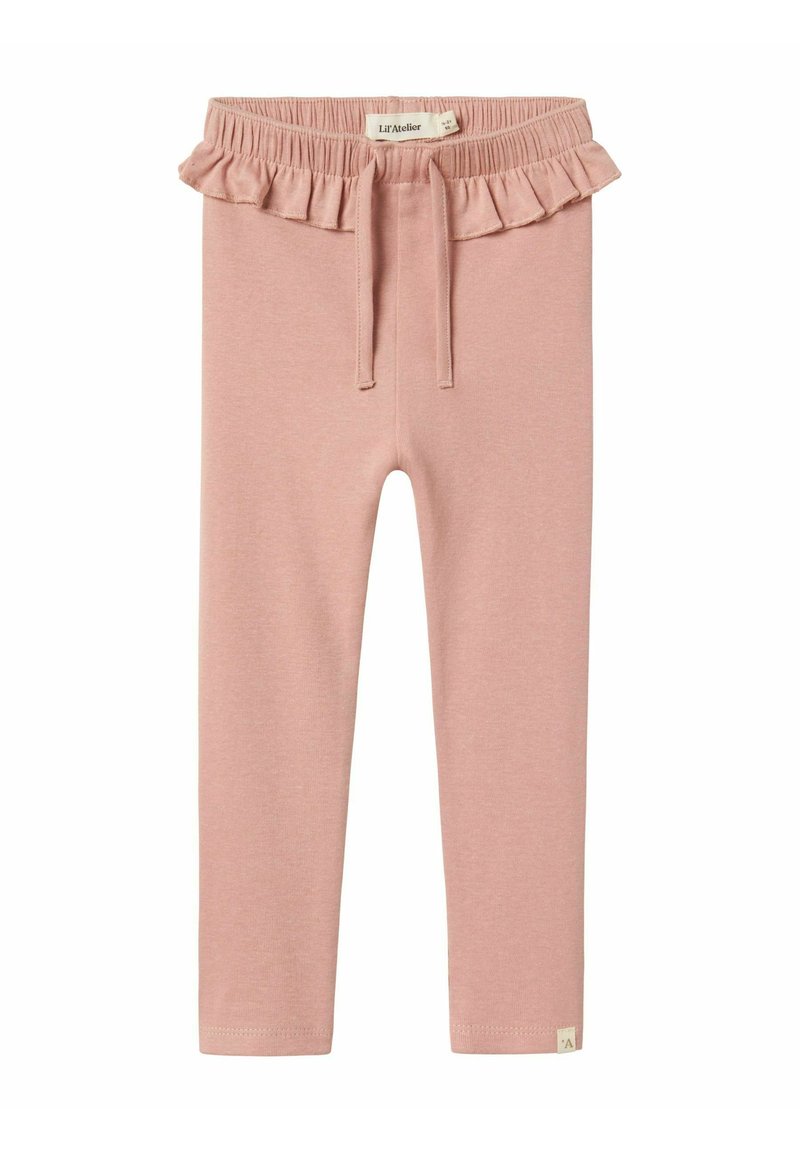 Ljust rosa leggings med volangmidja, elastisk snörning och en liten vit logotagg vid fållen, tillverkade av mjukt, töjbart tyg.