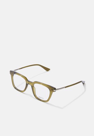 Ochelari rectangulari de culoare verde măslin cu lentile clare, având accente metalice pe brate și un finisaj lucios. Design ușor și modern.