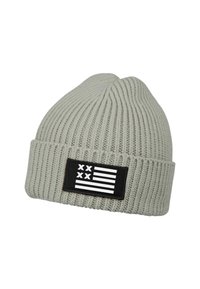Light gray knit beanie with ribbed texture, featuring a black patch displaying a white flag design with stars and stripes.