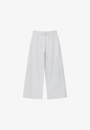 Pantalons larges gris clair en tissu doux avec une taille élastique. Le design présente une coupe ample pour un confort et une liberté de mouvement.