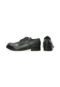 Zwarte leren schoenen met een ronde neus, met een gladde textuur, vetersluitingen en een lage, donkergekleurde hak.