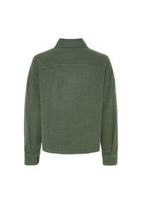 Grønne fløjlsskjortejakke med klassisk krave, lange ærmer og knapmanchetter. Teksturstoffet har et vertikalt ribbestruktur.
