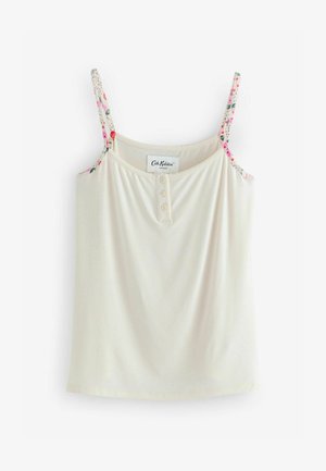 Kreemjas värvitoonis kampsun, millel on lillemustrilised rihmad, ning ujumislaadne kaelus ja kolm nööpi ees. Pehme kangastekstuuri.