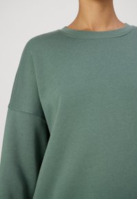 Vero Moda SONJA - Sportska majica - dark forest