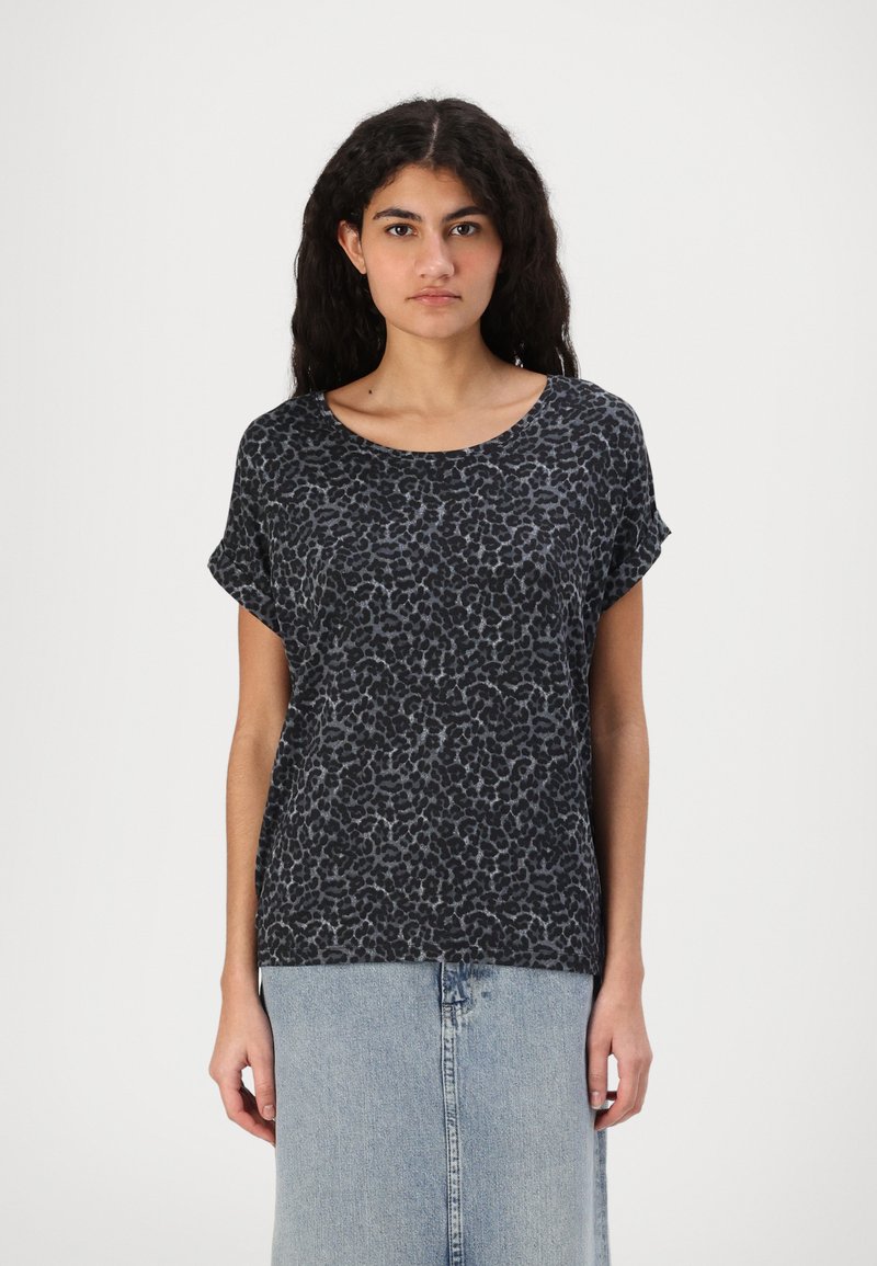 Black and gray leopard print t-shirt, short sleeves, rounded neckline, soft fabric. Worn with a light blue denim skirt, slight sheen.