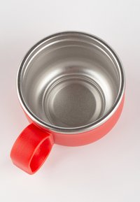 Red mug with a stainless steel interior and a wide handle. The exterior features a smooth, matte finish and rounded shape.