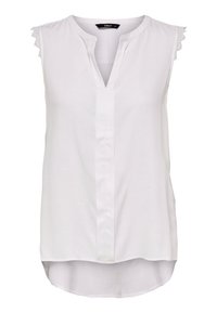 Blouse blanche sans manches avec un col en V, des accents subtils en dentelle texturée sur les épaules et un ourlet incurvé pour une silhouette allongée.