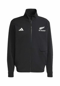 Sort zip-up jakke lavet af blødt materiale. Har hvidt logo og accenter på brystet, med høj krave og sidelommer.