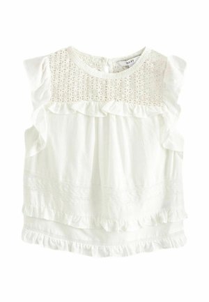 White sleeveless baby blouse with floral lace yoke, ruffle trim on shoulders and hem, and gathered fabric detailing.