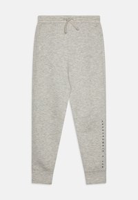 Gray sweatpants made of soft, textured fabric. Features an elastic waistband with drawstring and printed logo along the left leg.