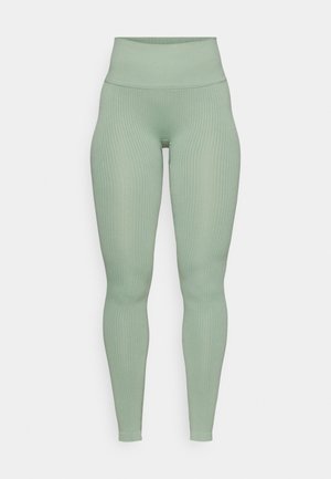 Leggings de cintura alta com textura canelada na cor verde sálvia suave. Fabricados em tecido elástico com um design justo para maior conforto.