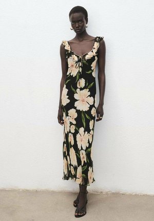 Black floral dress with a fitted silhouette, ruffled straps, pink flowers, and leaf patterns. Accented with a tie at the neckline.