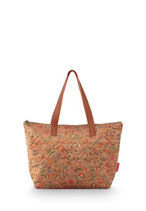 Tan quilted tote bag with multicolored floral pattern and brown leather handles standing upright on a white background.