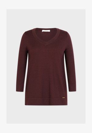 Burgundska V-izrezani pulover od meke pletene tkanine, s dugim rukavima i suptilnim logotipom na rubu. Glatka tekstura i opušten kroj.